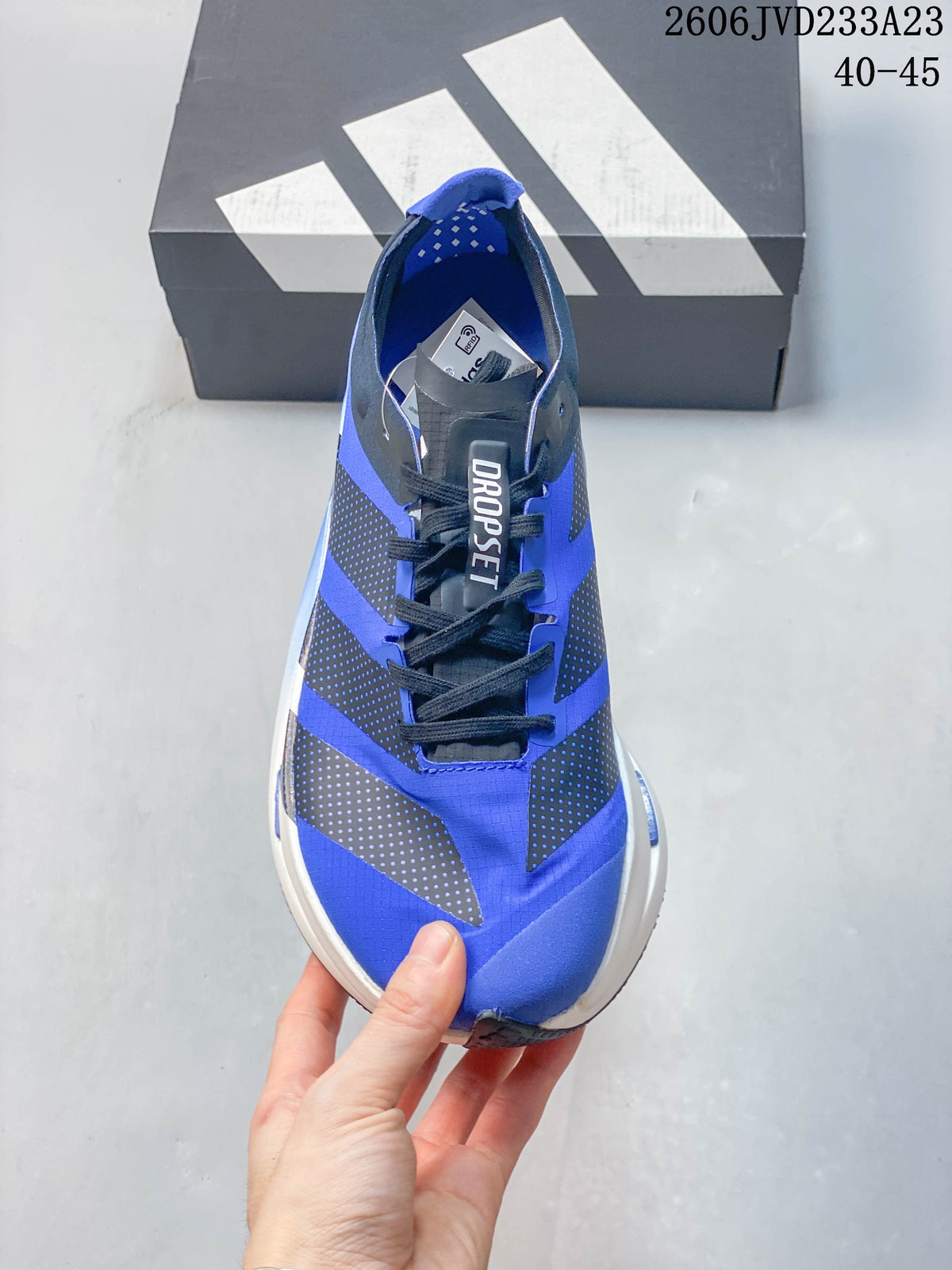 Top view of the blue lace-up running shoe with dark overlays