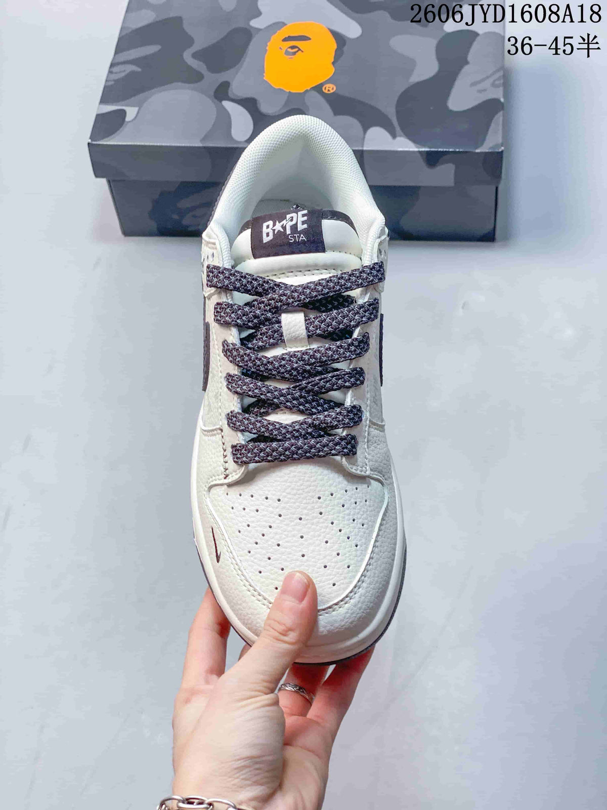 Top view showing the perforated toe, patterned laces, and BAPE STA tongue label