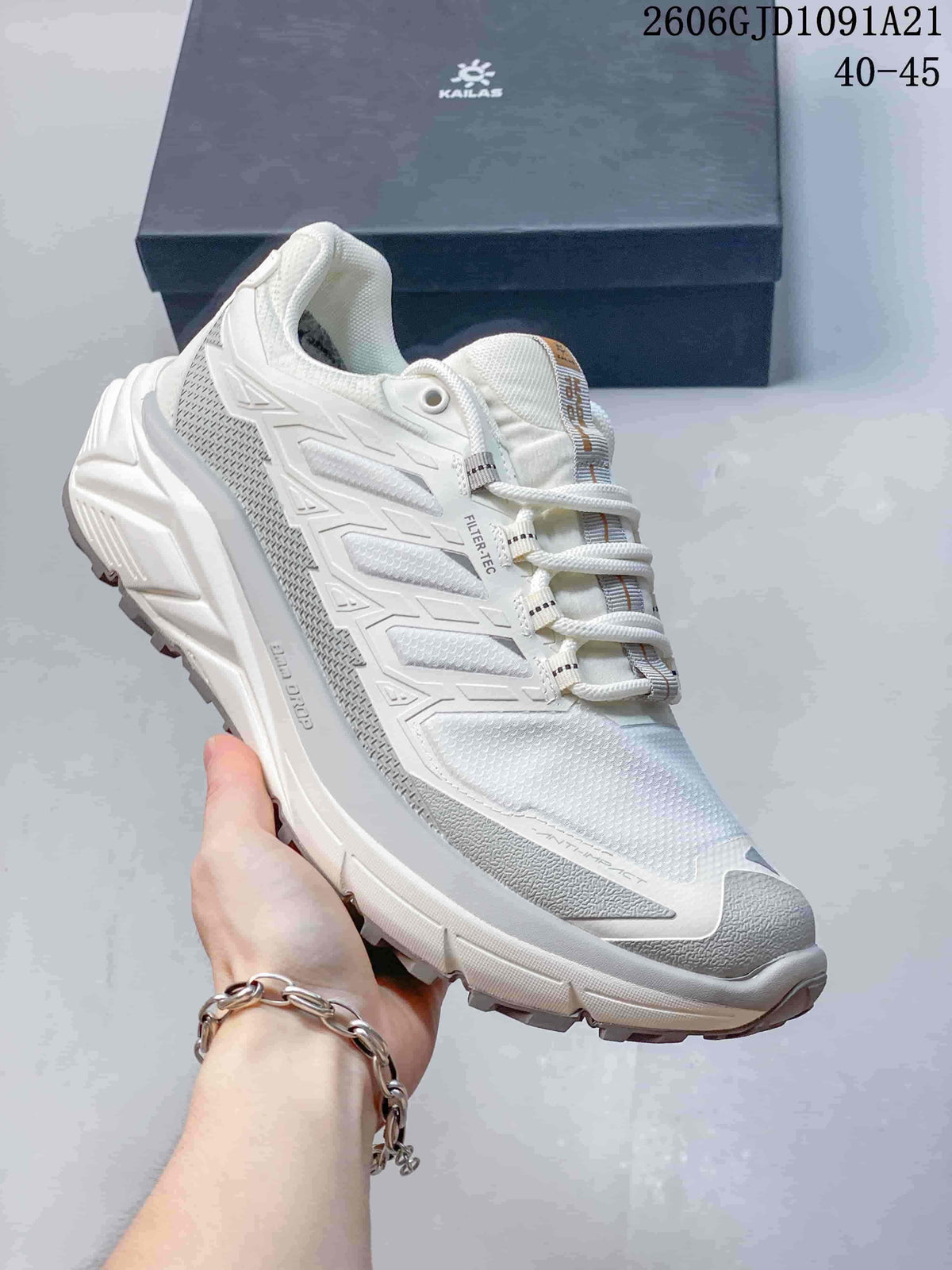 Angled side view of the white Kailas trail running shoe