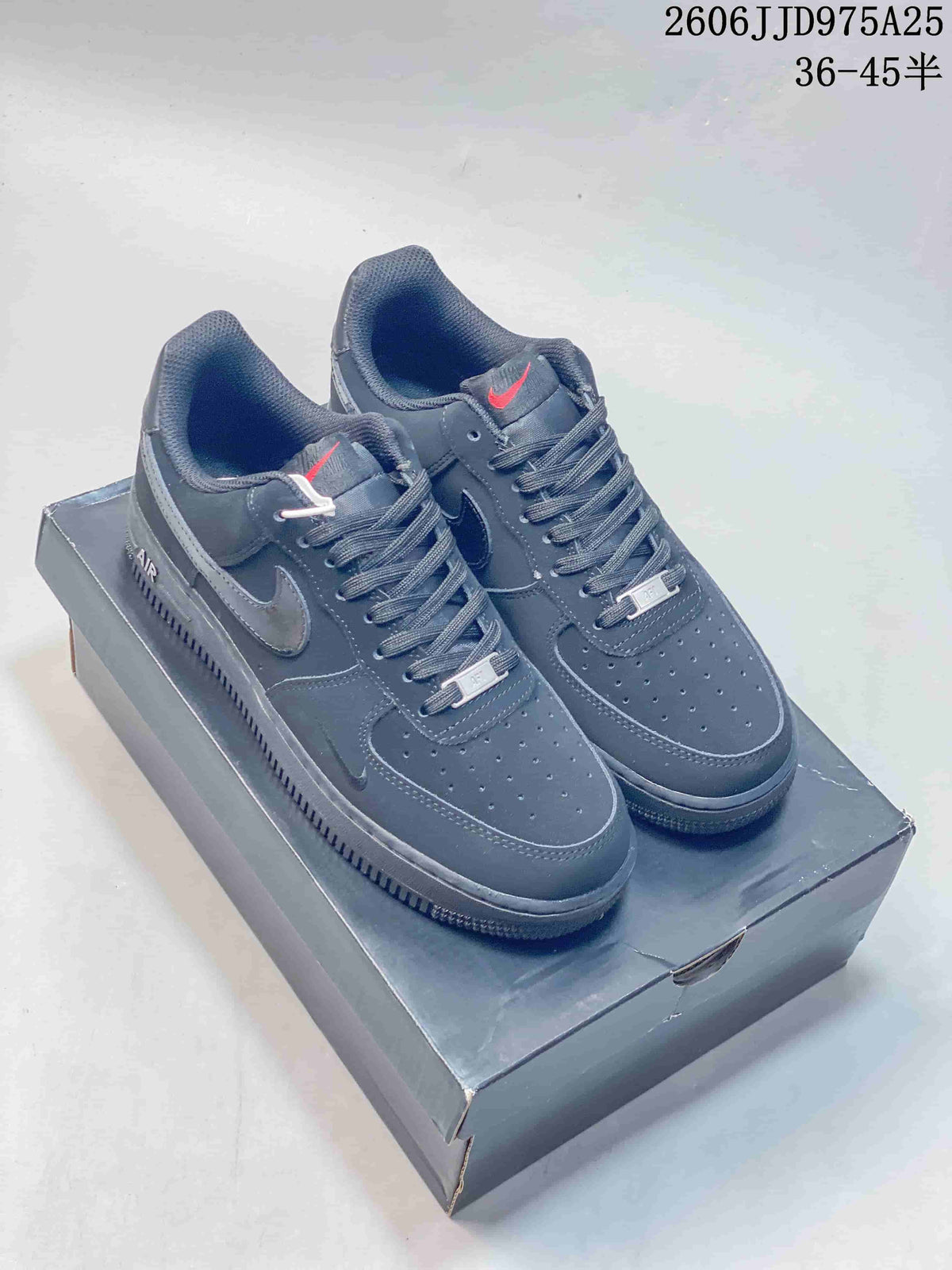 Dark gray low-top sneakers with perforated toe panels and contrasting Swoosh details