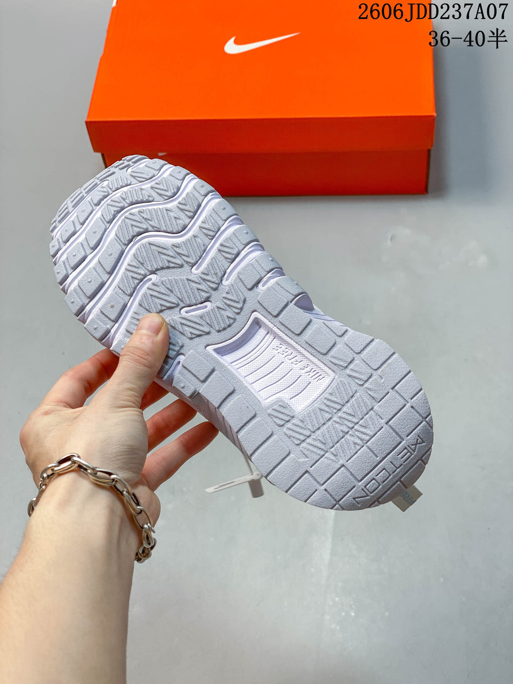 Close-up of the textured outsole on a pale mint Nike Free Metcon 6 shoe