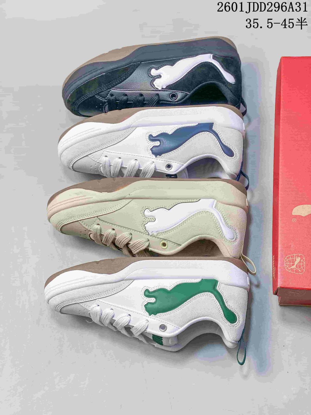 Four PUMA 180 colorways shown together, including dark, white-and-navy, light neutral, and white-and-green