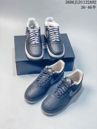 Pair of black Nike Air Force 1 '07 sneakers displayed on a shoe box, with the product code and 36–46 size range visible above.