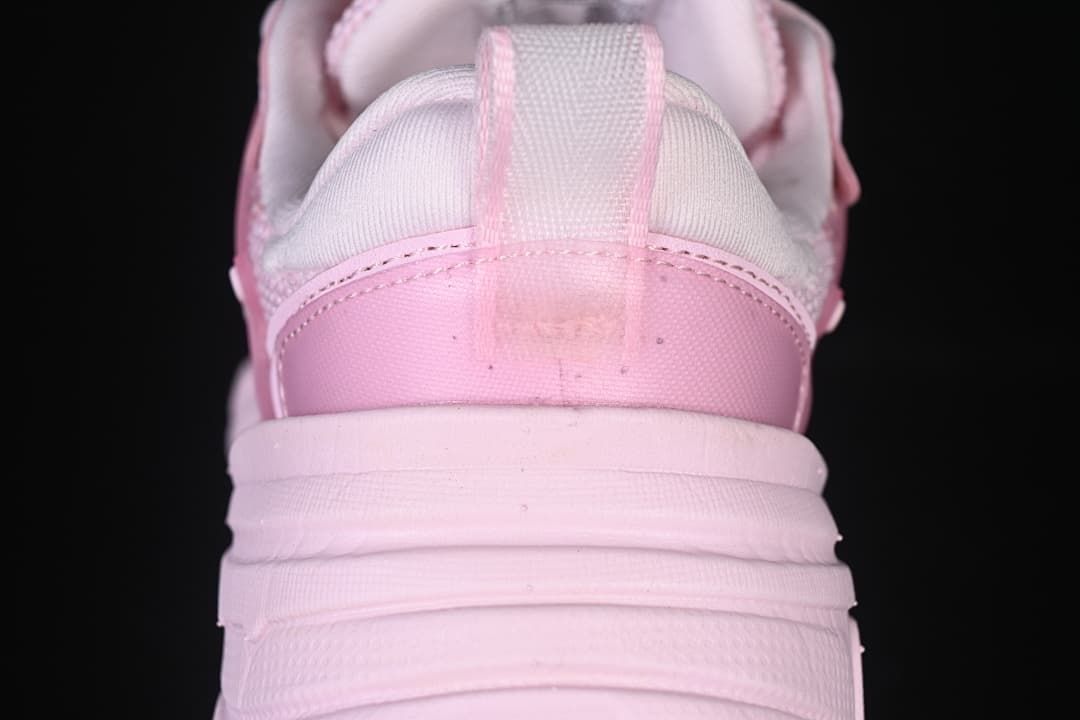 Rear view showing the heel, pull tab, and chunky sole