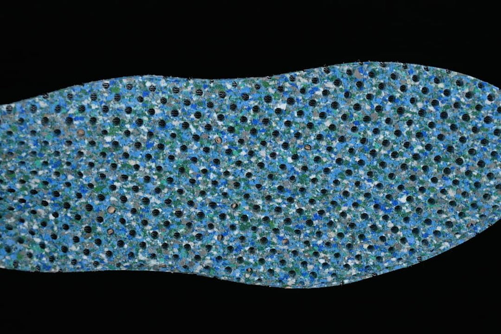 Close-up of the blue-toned textured outsole surface.