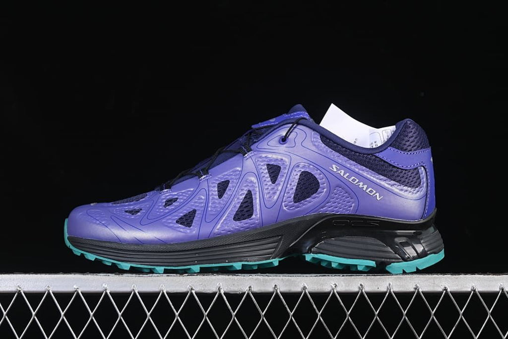 Side profile of a purple Salomon XT-Whisper Void shoe with a turquoise outsole.