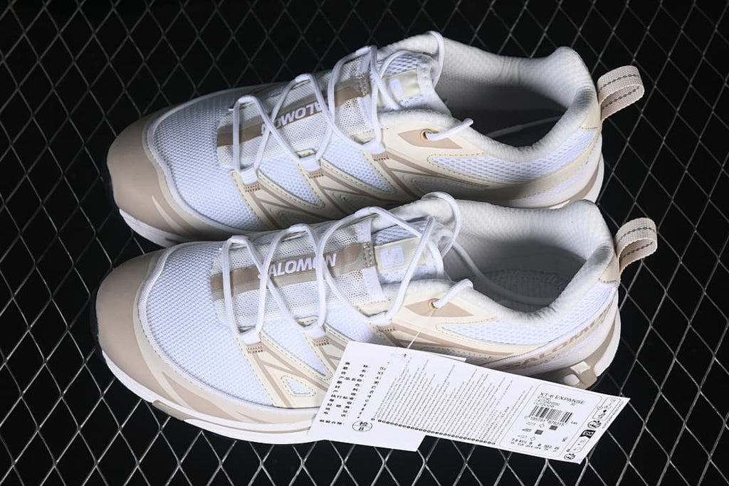 Pair of white and tan Salomon XT-6 Expanse sneakers shown from above.