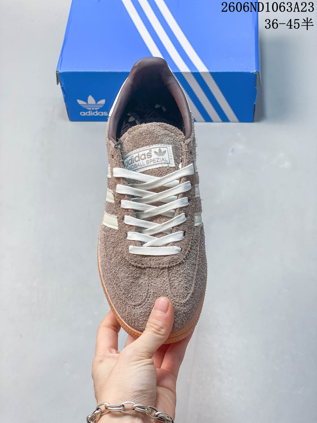 Top view of a taupe lace-up sneaker with visible Spezial tongue branding.