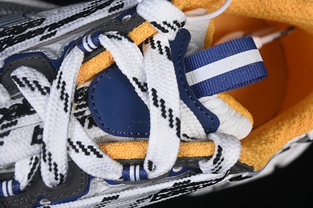 Close-up of the upper, laces, and blue heel pull tab