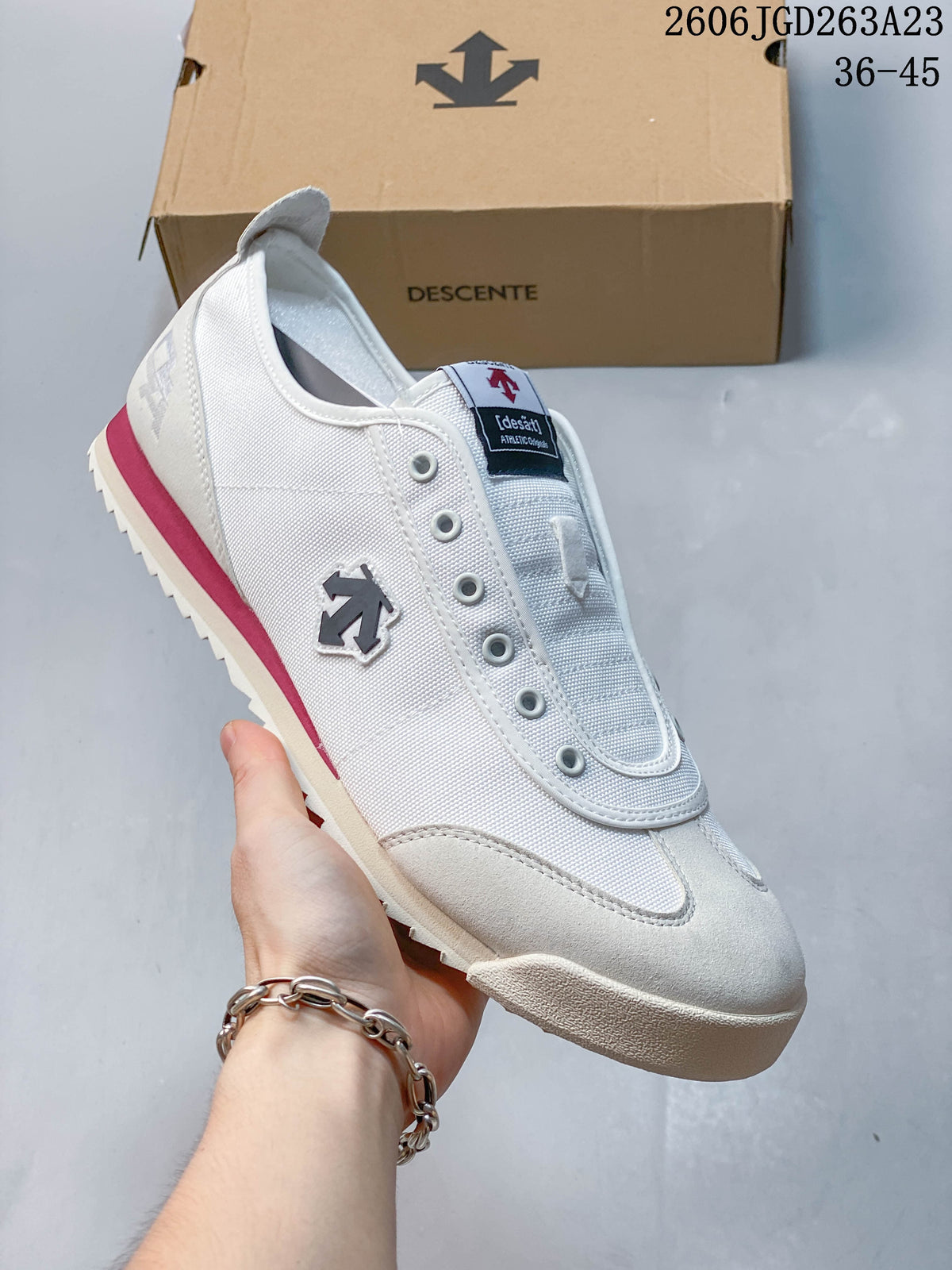 Side view highlighting the emblem, textured panels, and heel stripe