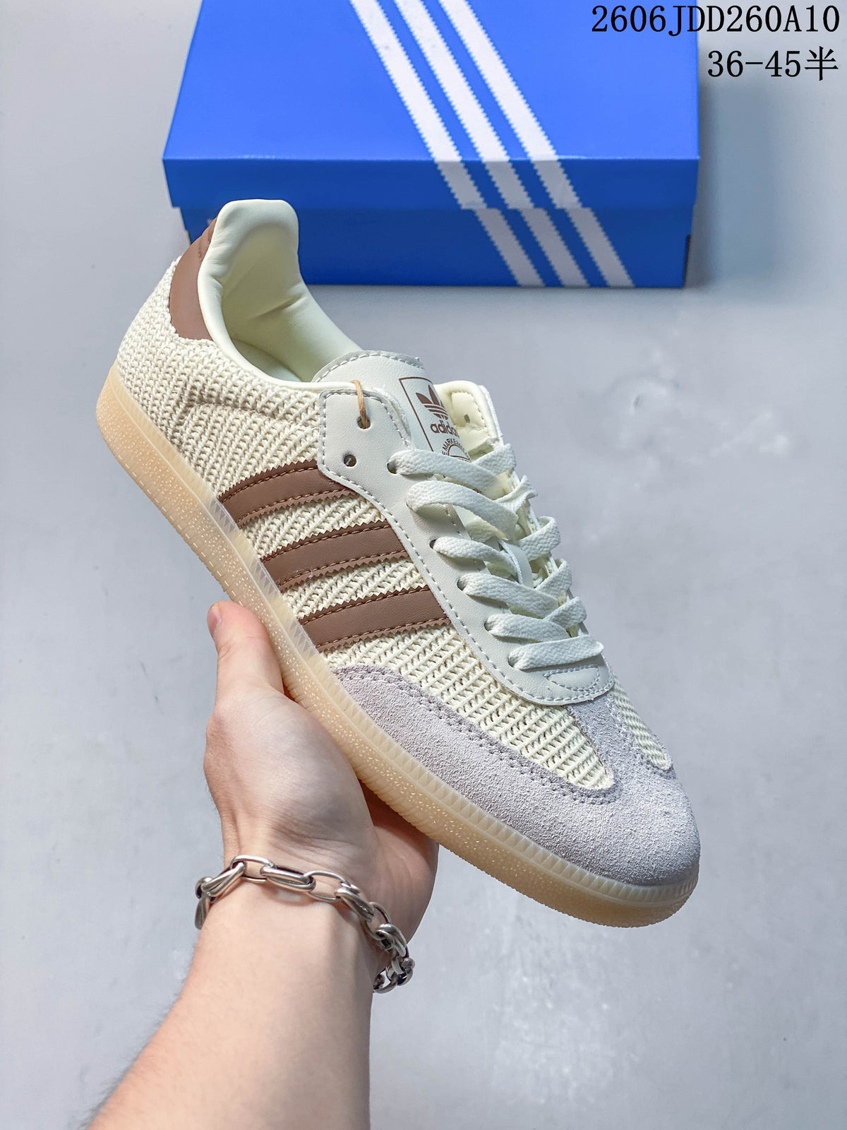 Side view of a beige and brown Samba OG sneaker with knit-look panels and a gum-colored outsole