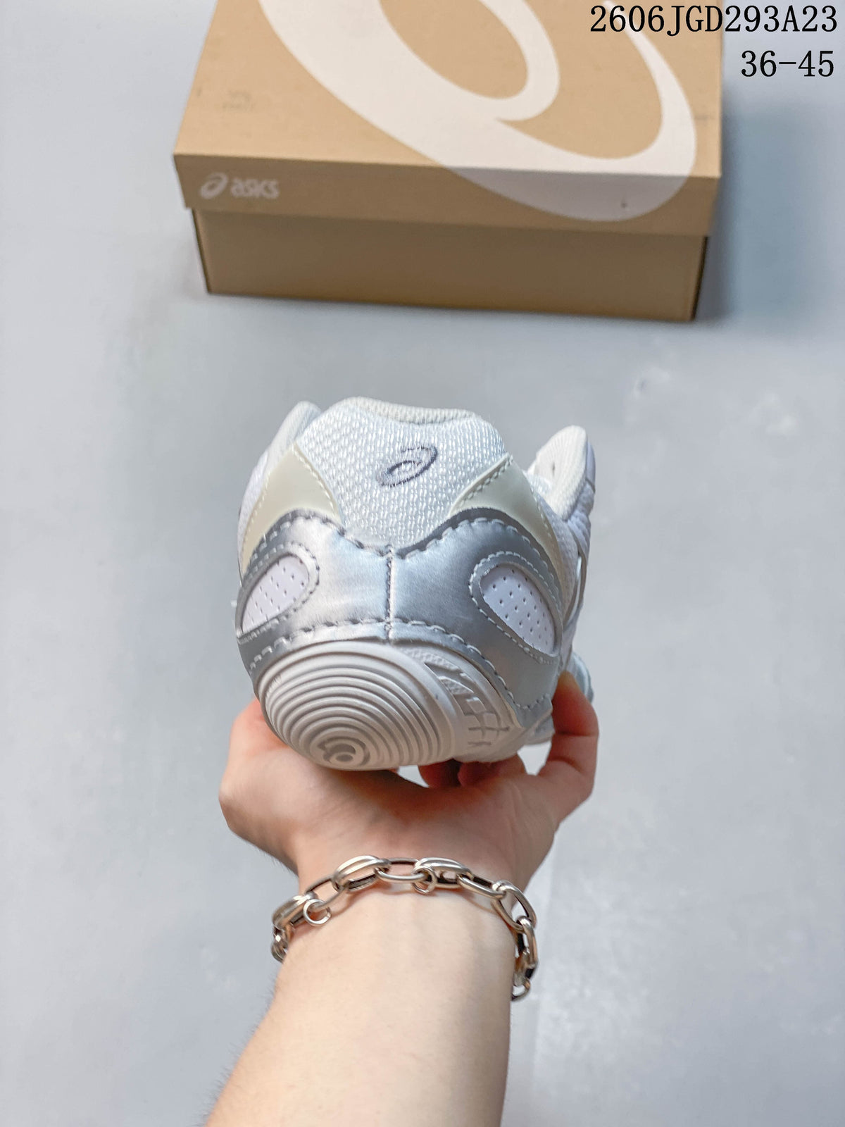 Rear view showing the heel construction and ASICS logo.