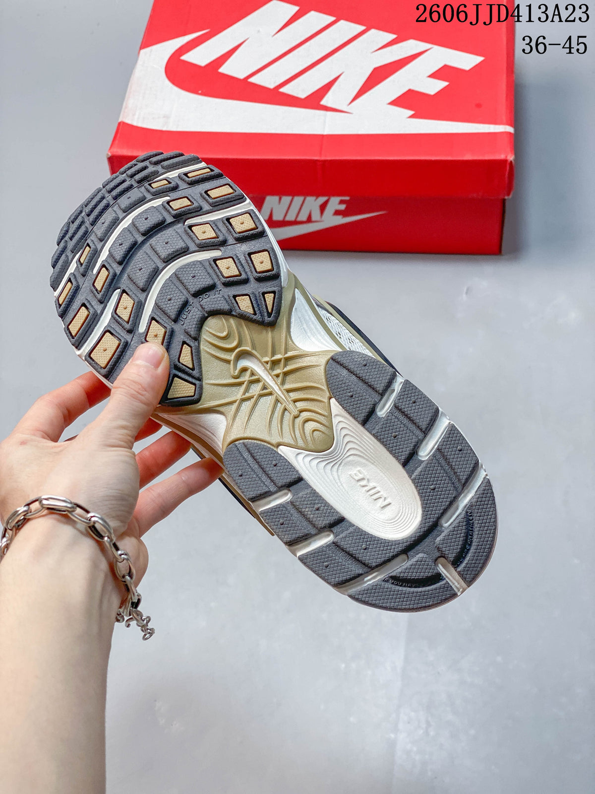Close-up of the shoe outsole with segmented tread and contrasting inserts