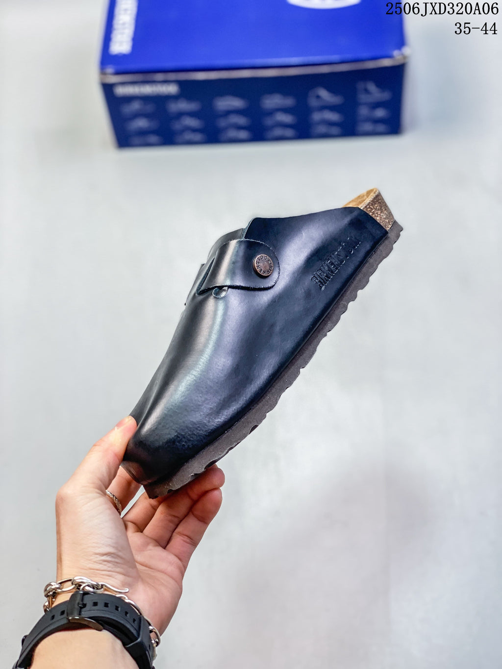 Side profile of a black closed-toe clog with an adjustable buckle strap; size range 35–44 is printed in the image.