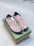 Pair of pink KEEN Jasper low-top sneakers with cream patterned laces on a shoebox