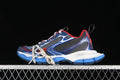 Pair of grey, blue, red and white Balenciaga Phantom sneakers against a dark background
