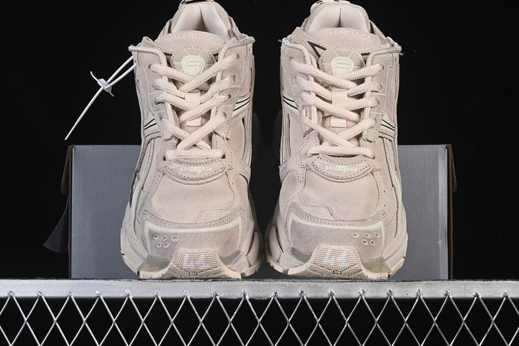 Front view of the pair showing the laces and layered toe panels