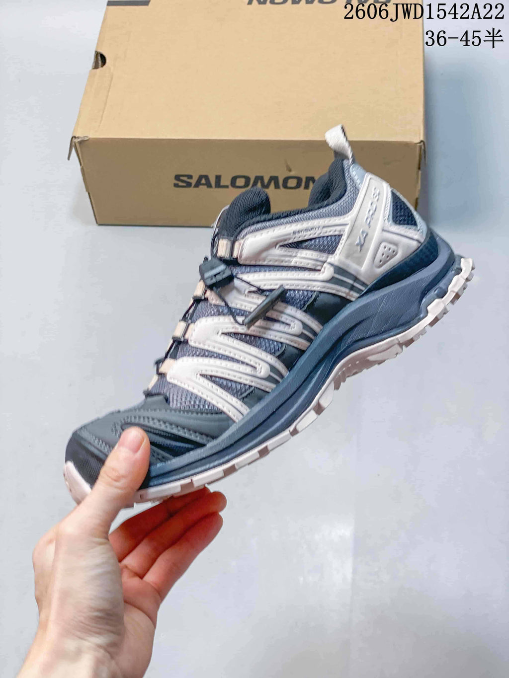 Side view of a Salomon XA Pro sneaker with layered overlays and quick-lace closure