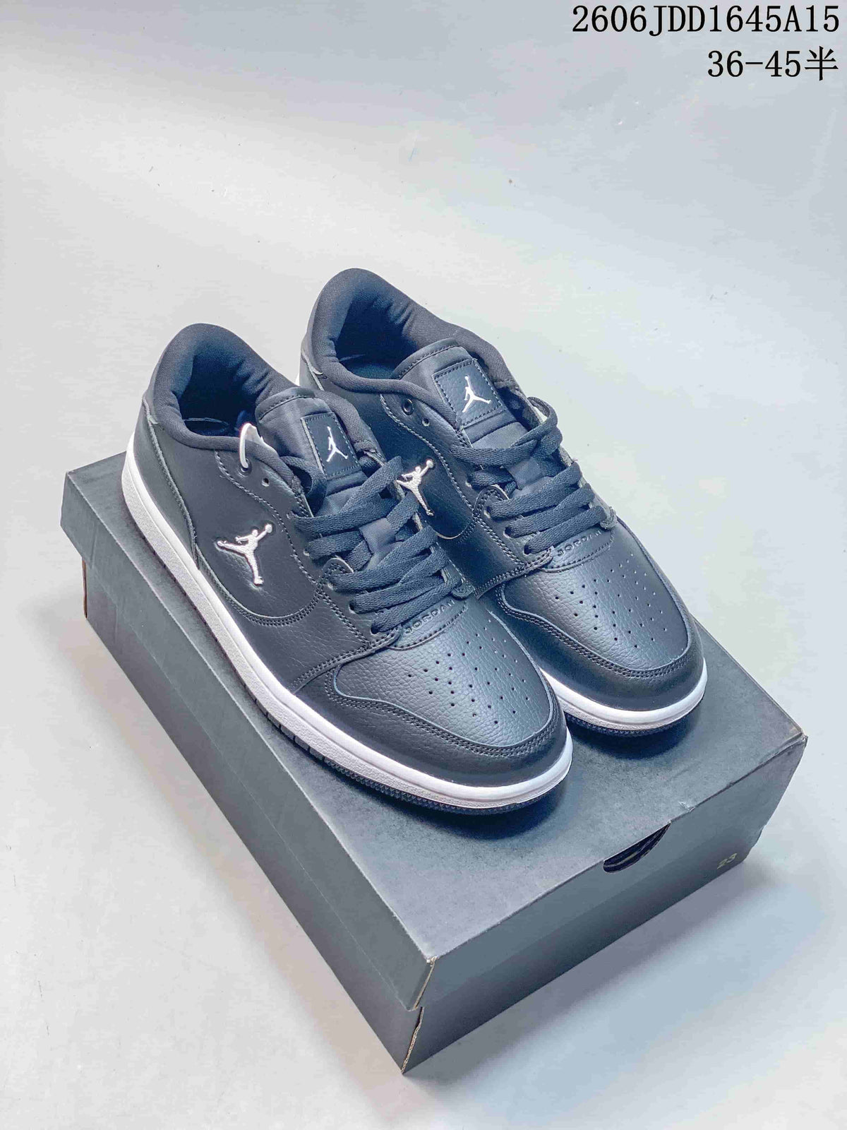 Pair of tonal gray Jordan Court Connect low-top sneakers with perforated toe panels.