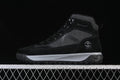 Side view of a black and charcoal Timberland mid-top outdoor boot.