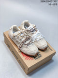 Pair of beige Miu Miu x New Balance 530 SL-style sneakers shown on a branded shoe box.
