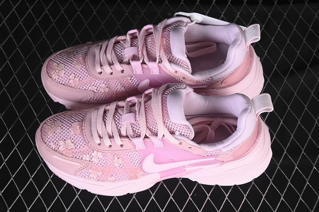 Pair of pink Nike V2K Run sneakers photographed from above at an angle.