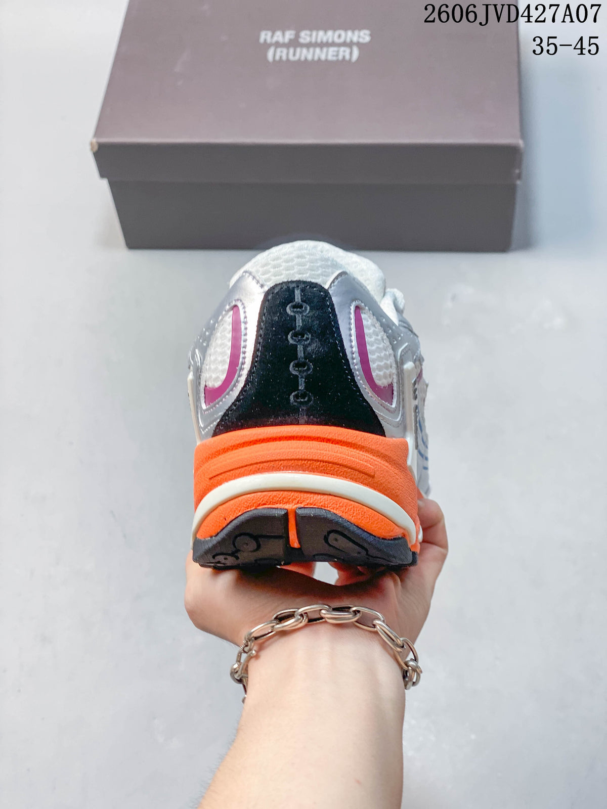 Rear view of a sneaker with a dark heel panel and bright orange heel section; image overlay shows 35–45.