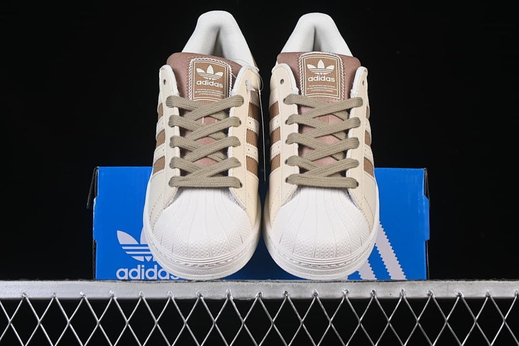 Front view of the pair showing shell toes and lace-up fronts.