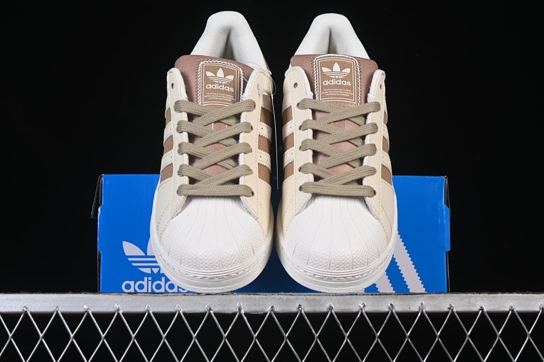 Front view of the pair showing shell toes and lace-up fronts.