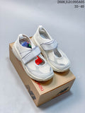 Pair of white New Balance Breeze Mary Jane sneakers with light gray straps and accents, shown on a shoebox