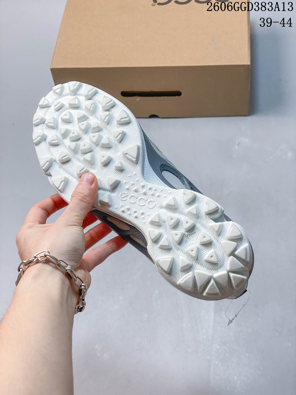 Close-up of the white lugged outsole on an ECCO sneaker.