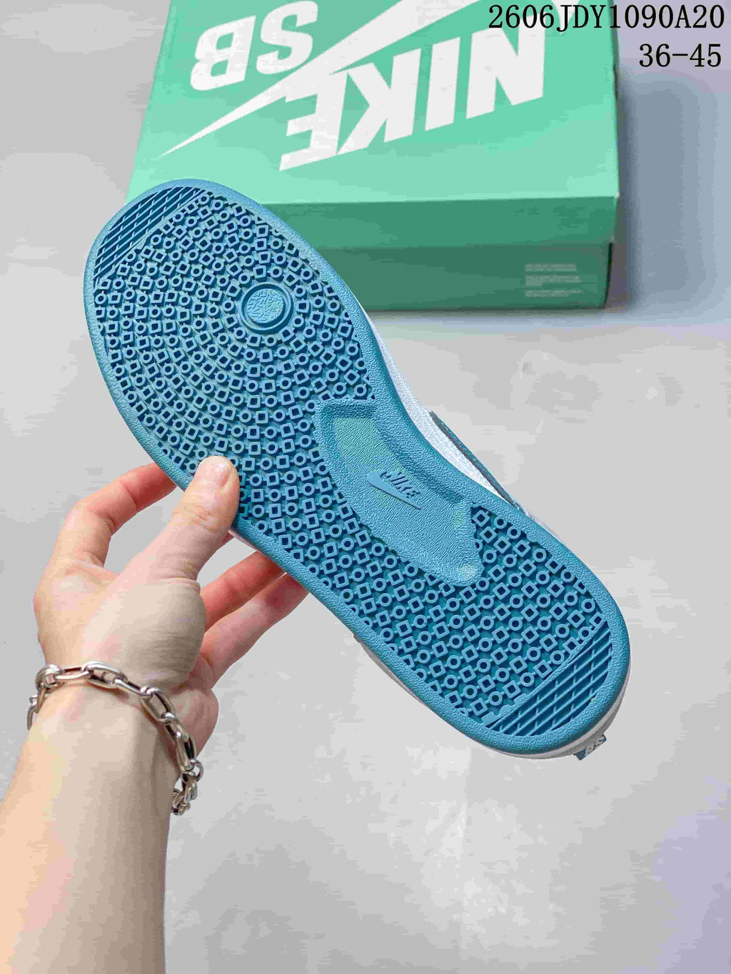 Close-up of the patterned teal outsole on a Nike SB Alleyoop shoe