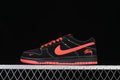 Side view of a black Nike SB Dunk Low-style shoe with red-orange Swoosh, laces, heel script, and outsole accents.