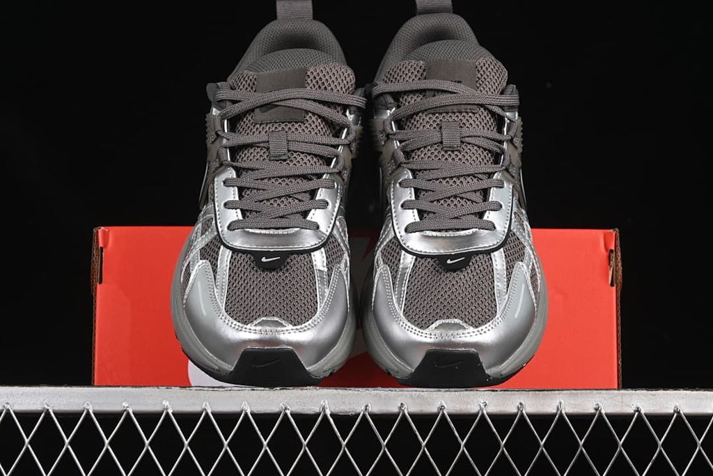 Front view of the pair showing mesh uppers, laces, and metallic-look toe overlays