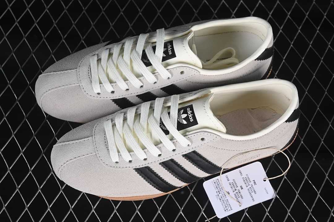 Pair of cream and black Tokyo W sneakers shown from above