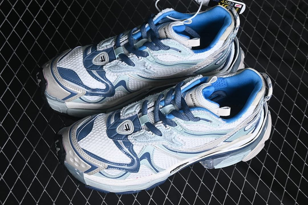 Pair of white and blue sneakers shown from above
