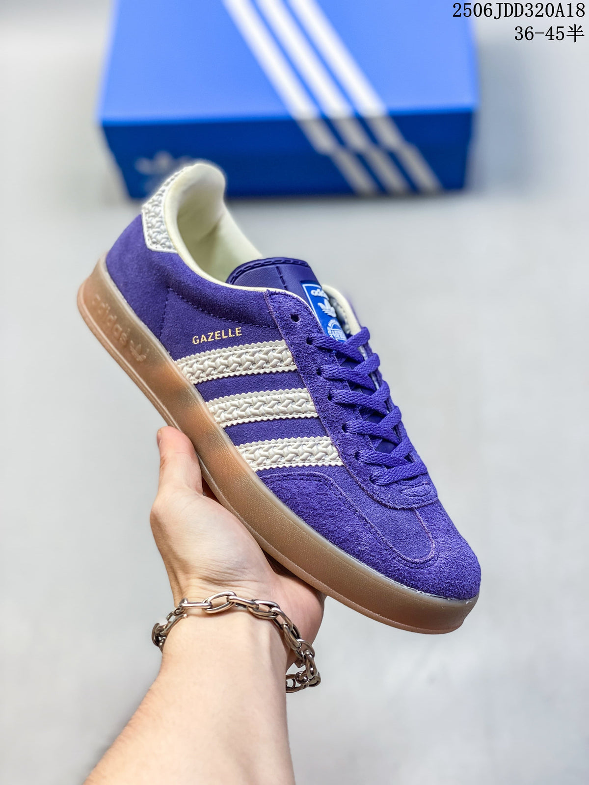 Angled side view of the purple Gazelle sneaker with cream stripes and gum outsole.