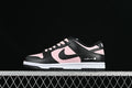 Side view of a black and pale pink low-top Dunk sneaker with white midsole and sakura-style heel embroidery
