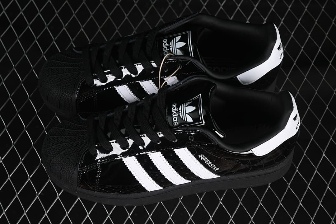 Pair of black and white Adidas Superstar II sneakers viewed from above