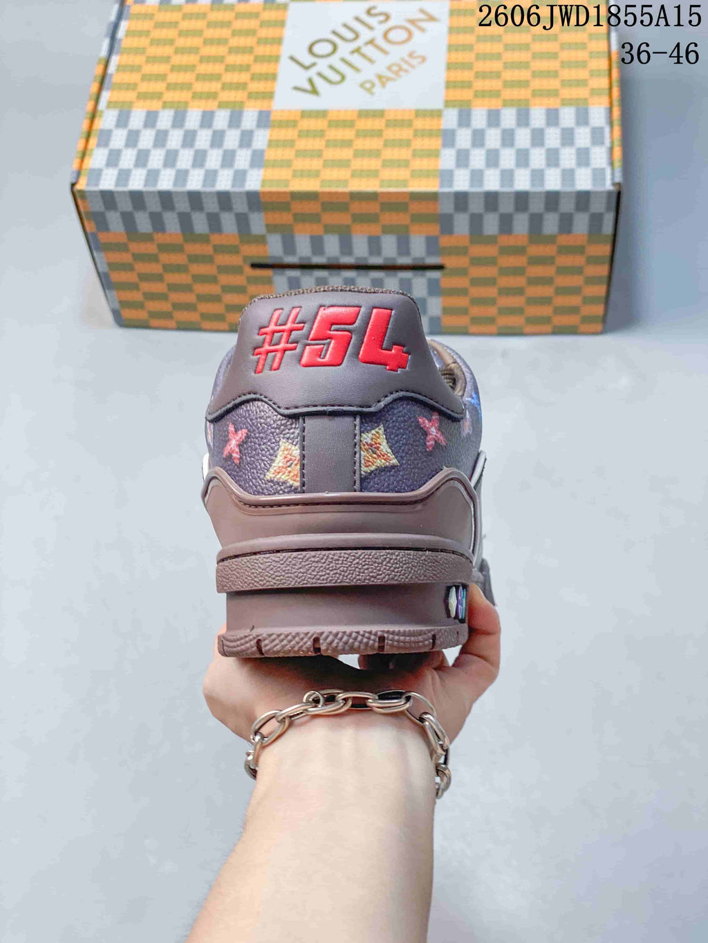 Rear view of the sneaker showing a patterned heel panel and embroidered number detail.