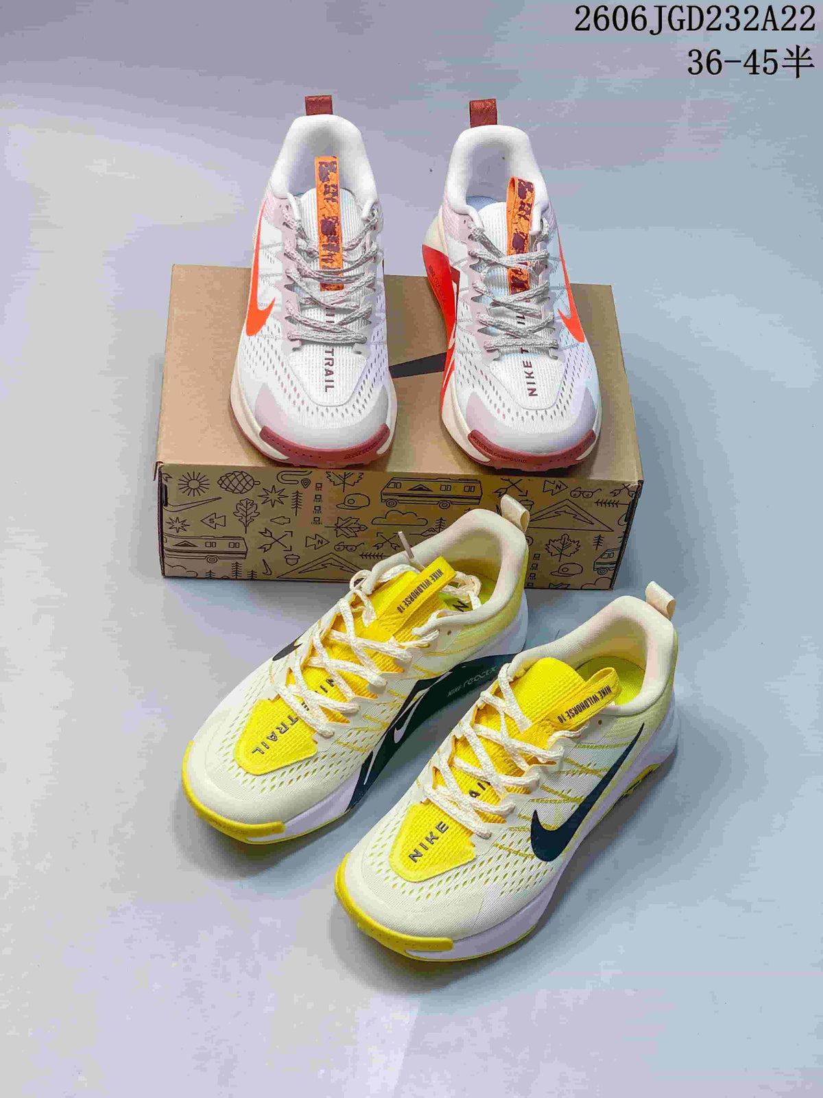 Two Nike Wildhorse 10 colorways displayed together: orange and pink accents, and yellow and dark accents.