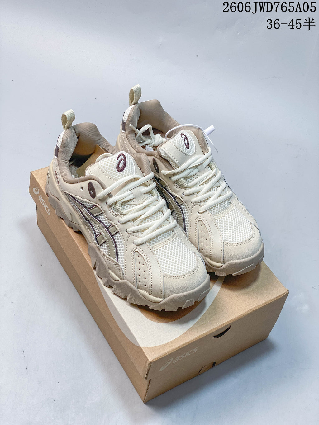 Cream ASICS Gel-TRUCK sneakers displayed on a shoebox