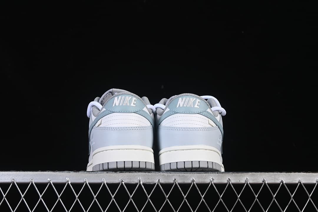 Rear view of both sneakers showing heel details