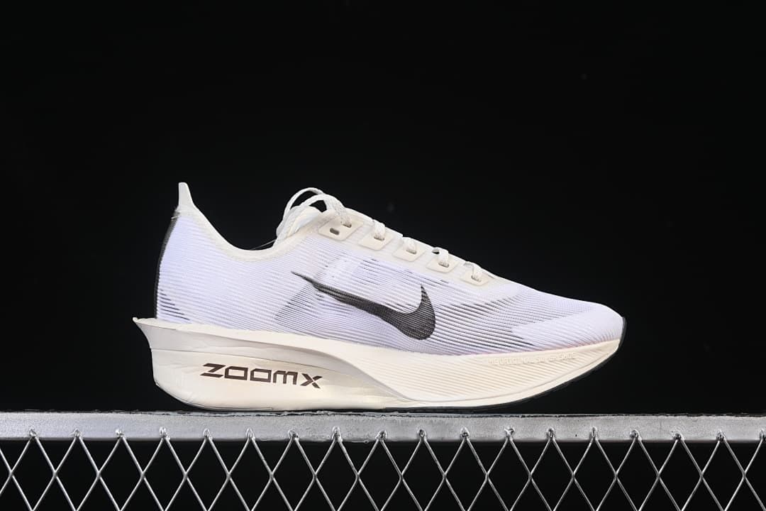 Side profile showing the white upper, black Swoosh, and ZoomX marking