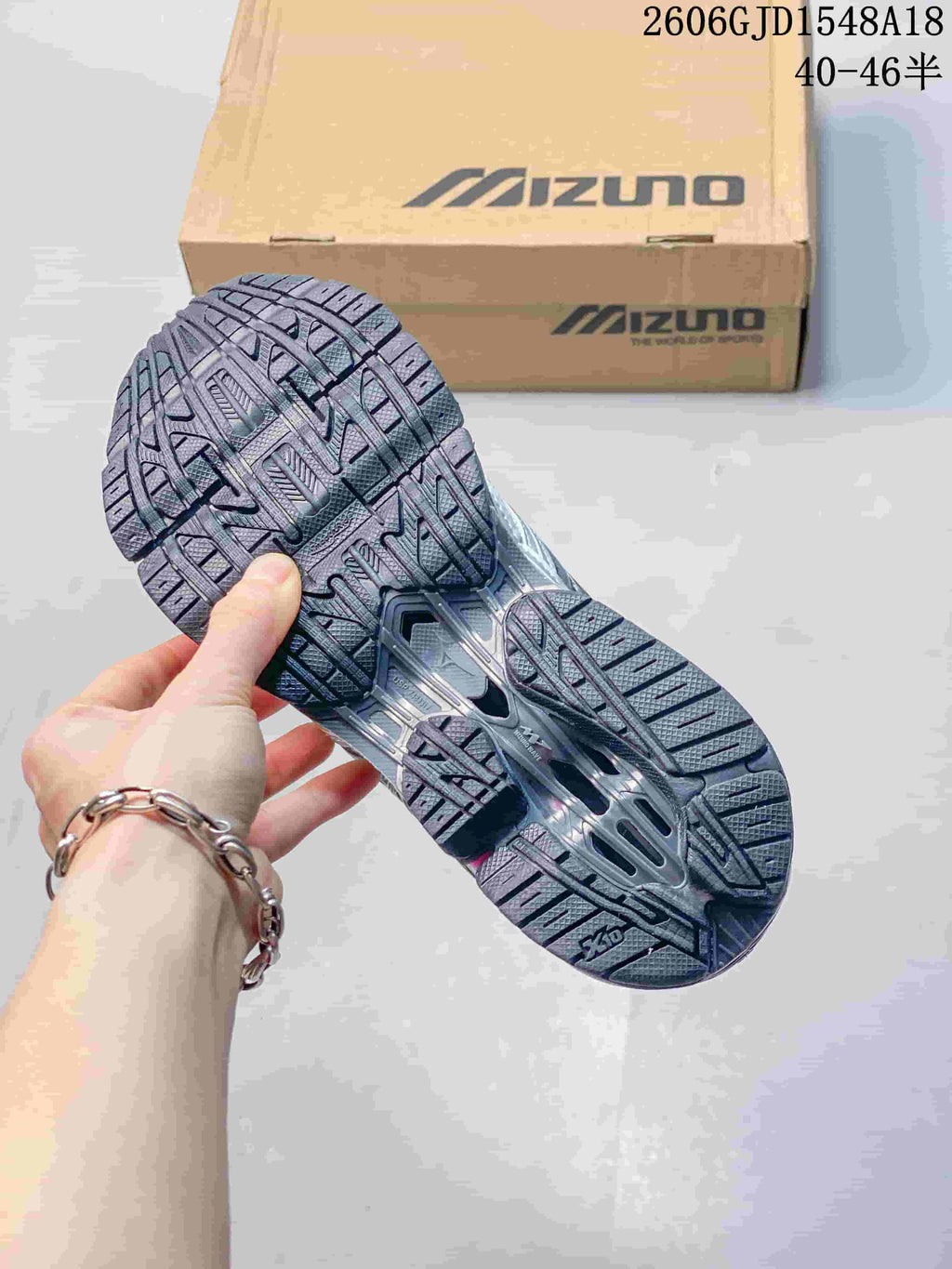 Underside of a Mizuno sneaker showing the outsole tread