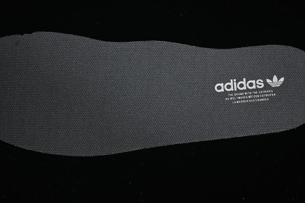 Close-up of textured insole with adidas branding