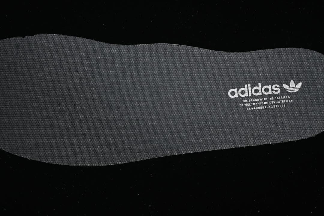 Close-up of textured insole with adidas branding
