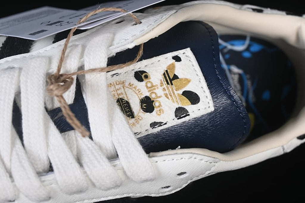 Close-up of the tongue label, laces, and navy tongue panel.