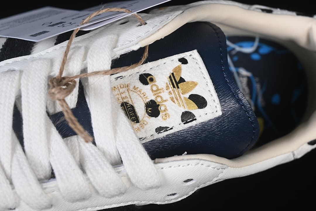 Close-up of the tongue label, laces, and navy tongue panel.