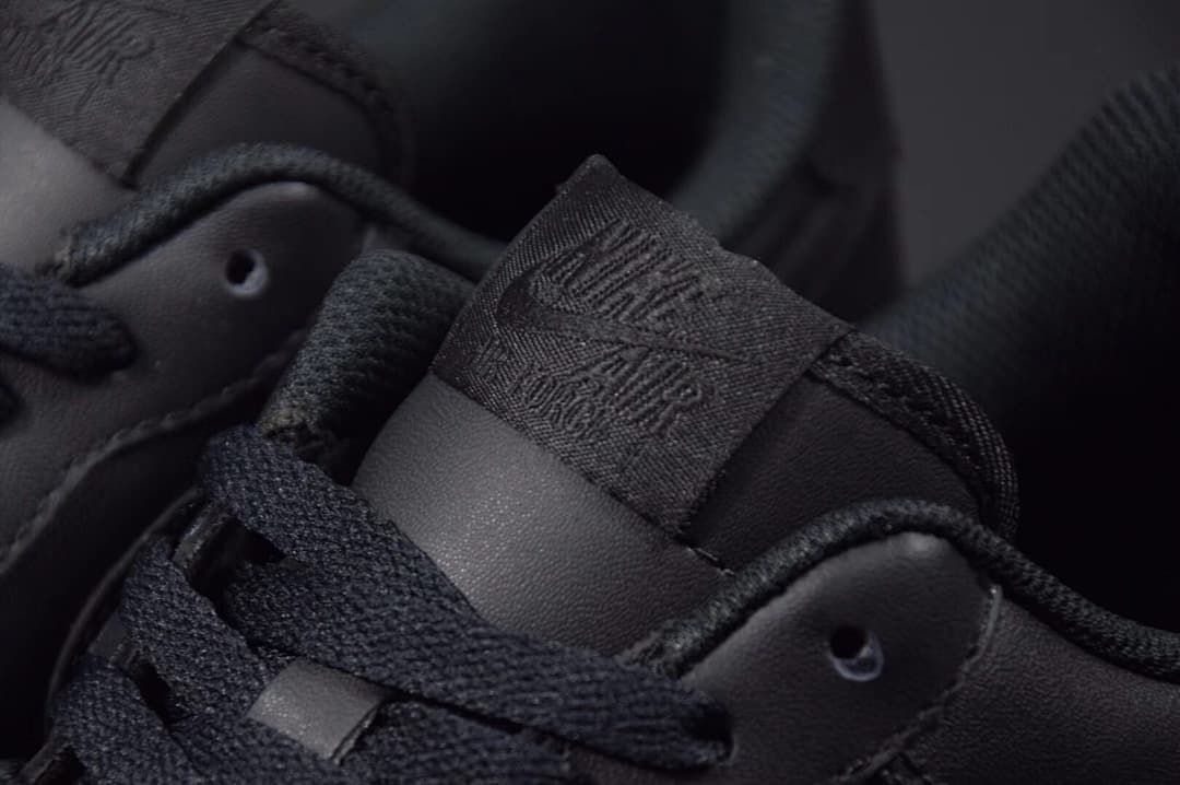 Close-up of the tongue label and black laces